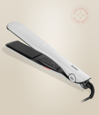 Pearl White Omnia Styler Max lying open, with black plates and control panel visible.