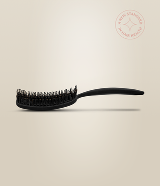 Side profile of the black OmniFlex Vent Brush, showing its curved head and raised handle.